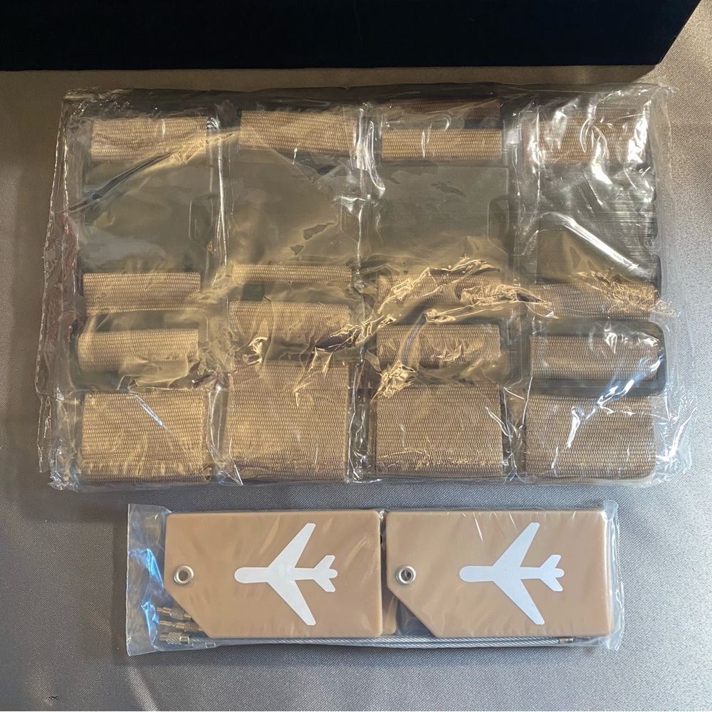 NWT set of four luggage straps and four luggage tags color is khaki